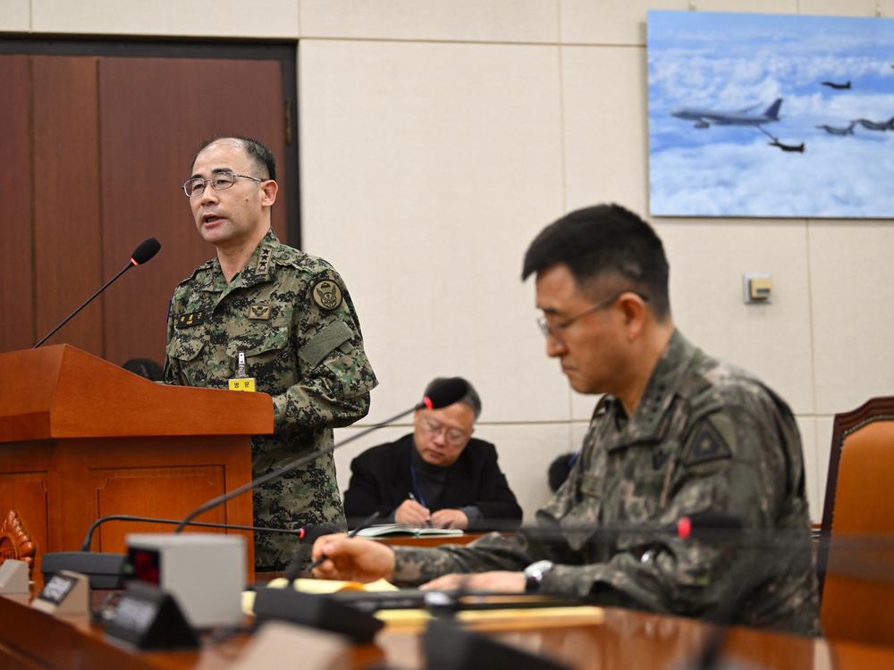 South Korean Lt. Gen. Kwak Jong-keun (left), chief of the Army Special Warfare Command, answers lawmakers' questions beside South Korea Army chief General Park An-su (right) during an emergency session of the parliamentary defense committee, relating to President Yoon Suk Yeol's declaration and lifting of martial law, at the National Assembly in Seoul, on Tuesday.