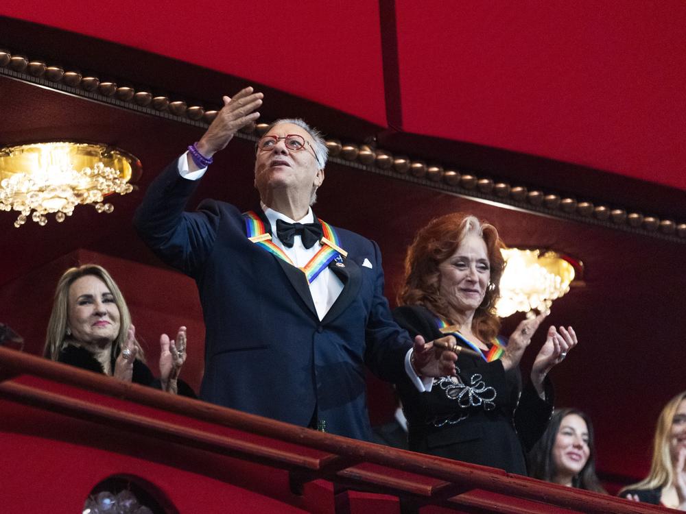 2024 Kennedy Center honoree jazz trumpeter, pianist, and composer Arturo Sandoval, blows a kiss as fellow honoree blues rock singer-songwriter and guitarist Bonnie Raitt, applauds as they arrive during the 47th Kennedy Center Honors at the John F. Kennedy Center for the Performing Arts in Washington, Sunday, Dec. 8, 2024.