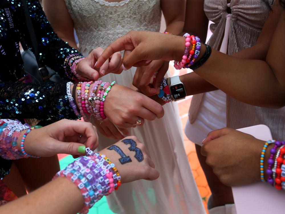 Swifties swap friendship bracelets outside Sydney, Australia's Accor Stadium in February 2024.