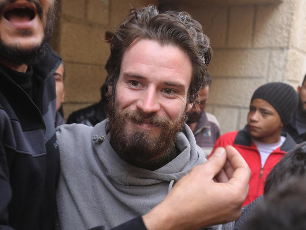 Travis Timmerman, a U.S. citizen who had entered Syria from Lebanon on a Christian pilgrimage and had been detained for several months, speaks with reporters in Damascus on Thursday, after he was found in the village of Thihabiyeh east of the capital following the fall of longtime Syrian President Bashar al-Assad.