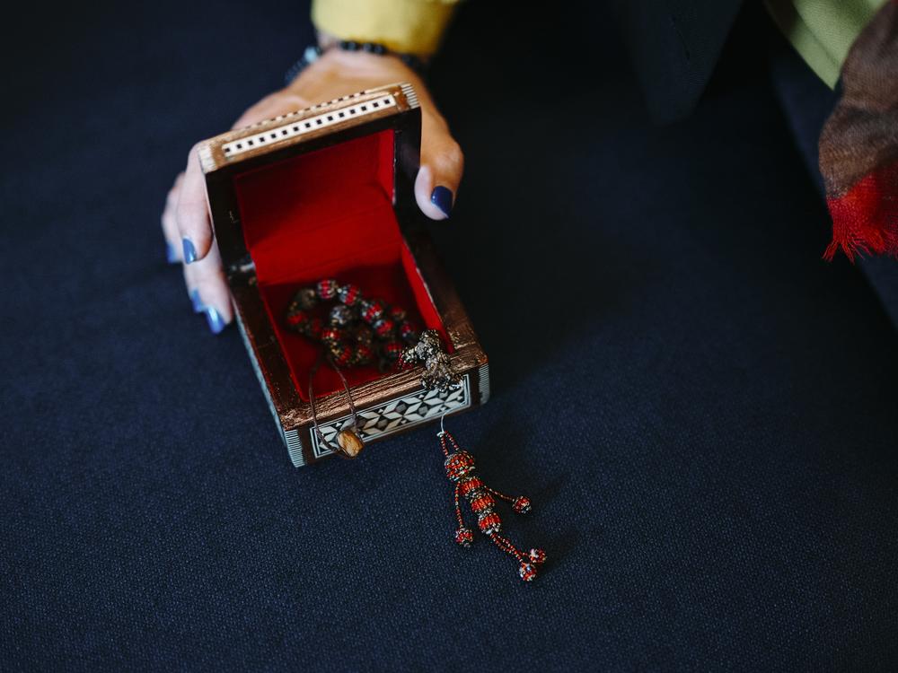 Nazan Rashidi holds a trinket that was made by her now husband more than 10 years ago in a detention center.