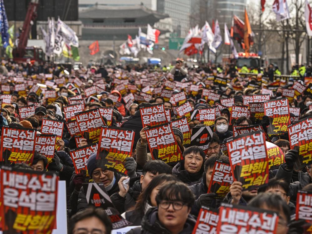 Demonstrators from a labour group take part in a protest calling for the ouster of South Korea President Yoon Suk Yeol outside City Hall in Seoul on Dec. 12, 2024.