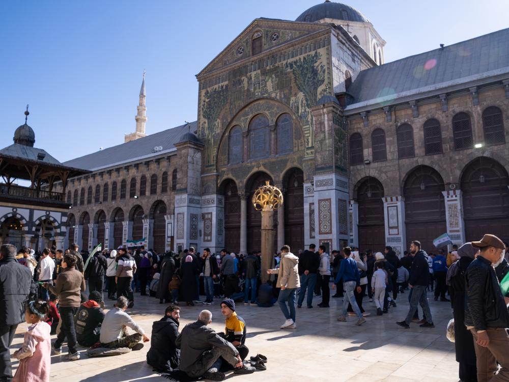 People gather in the Ummayad Mosque courtyard on Friday.