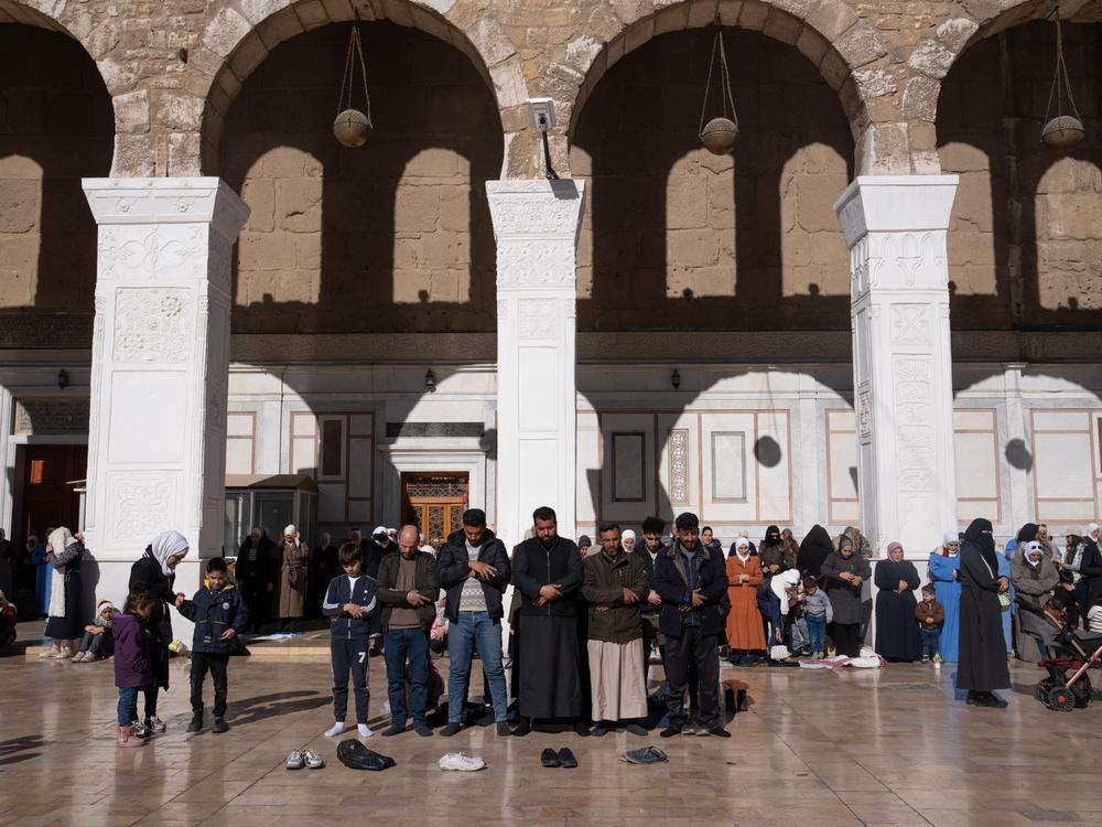 People gather on Friday at the Umayyad Mosque on Friday.