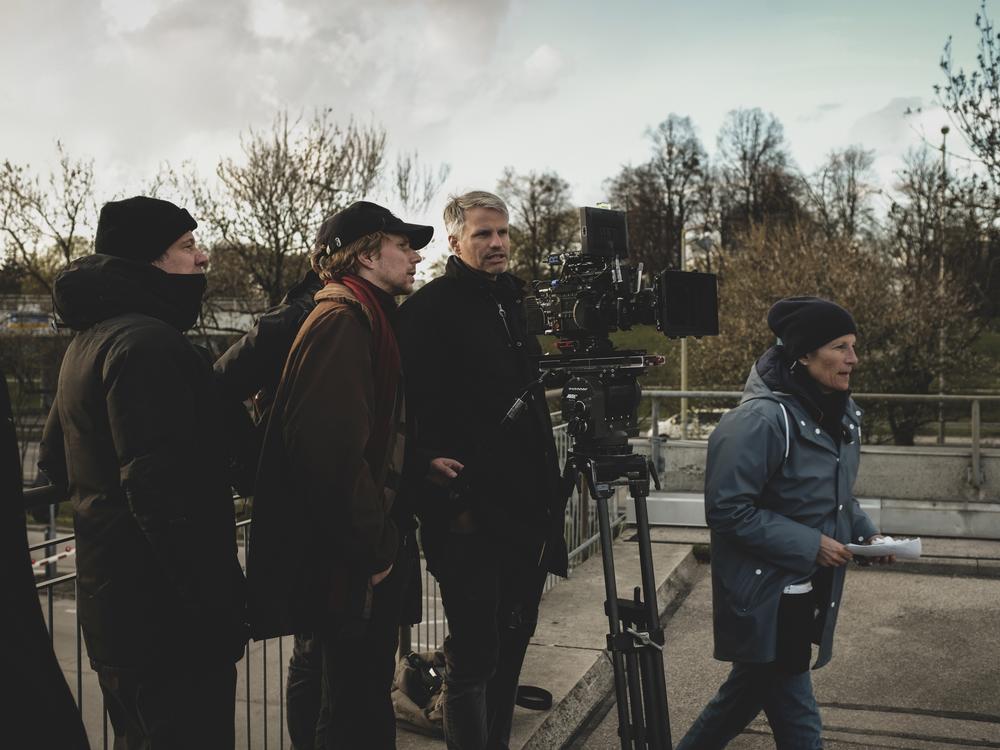 Cinematographer Markus Förderer, behind the camera, and director Tim Fehlbaum, to his right, on the set of Paramount Pictures' <em>September 5.</em>