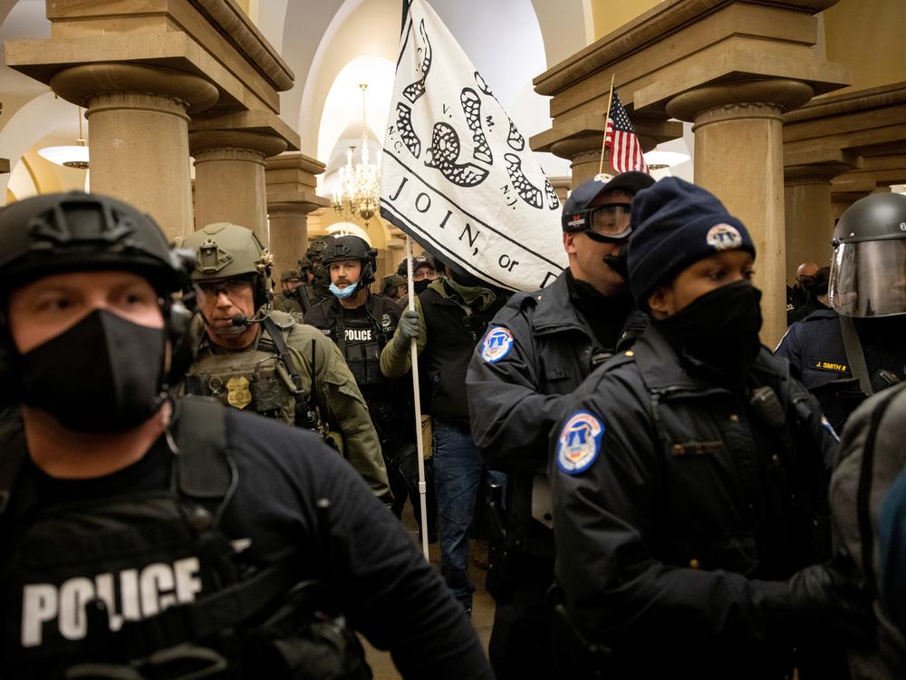 FBI and ATF law enforcement push out supporters of then-President Donald Trump as they protested inside the U.S. Capitol on January 6, 2021.