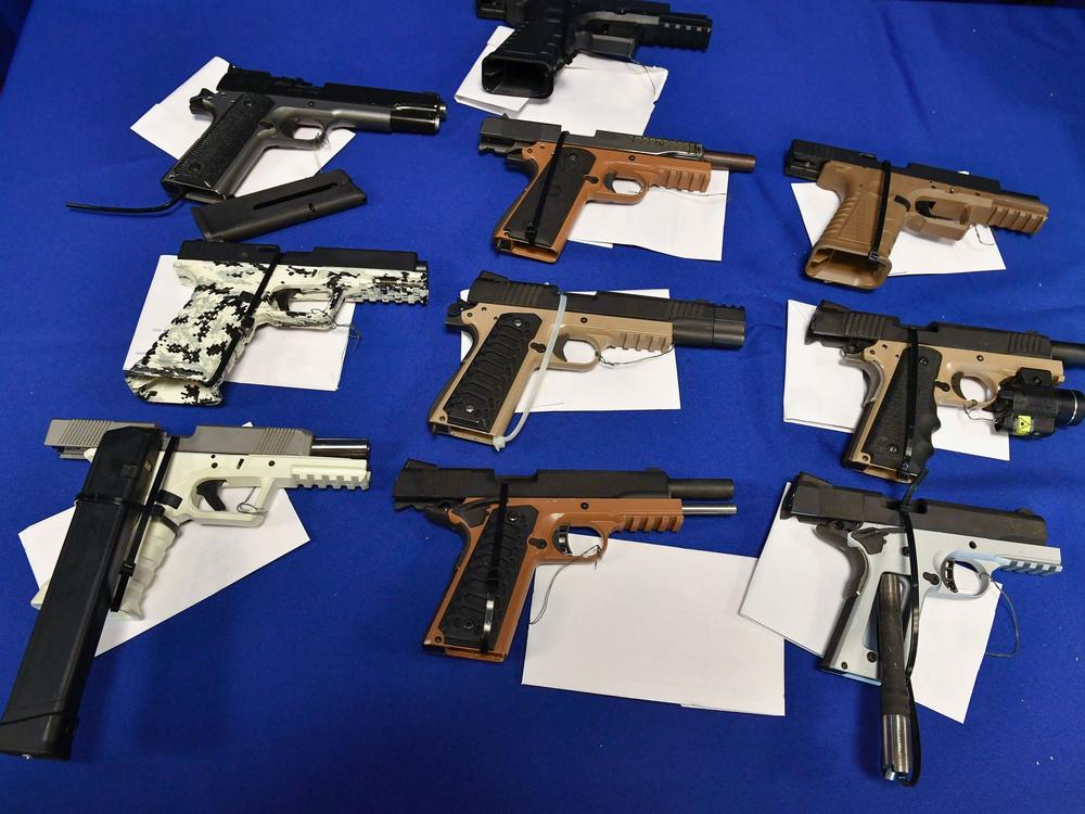 Ghost guns seized in federal law enforcement actions are displayed at the Bureau of Alcohol, Tobacco, Firearms, and Explosives field office in California in 2022.