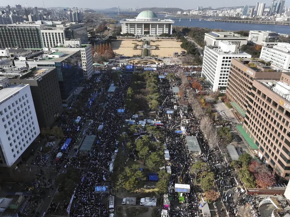 Participants gather during a rally to demand South Korean President Yoon Suk Yeol's impeachment outside the National Assembly in Seoul, South Korea, on Saturday.