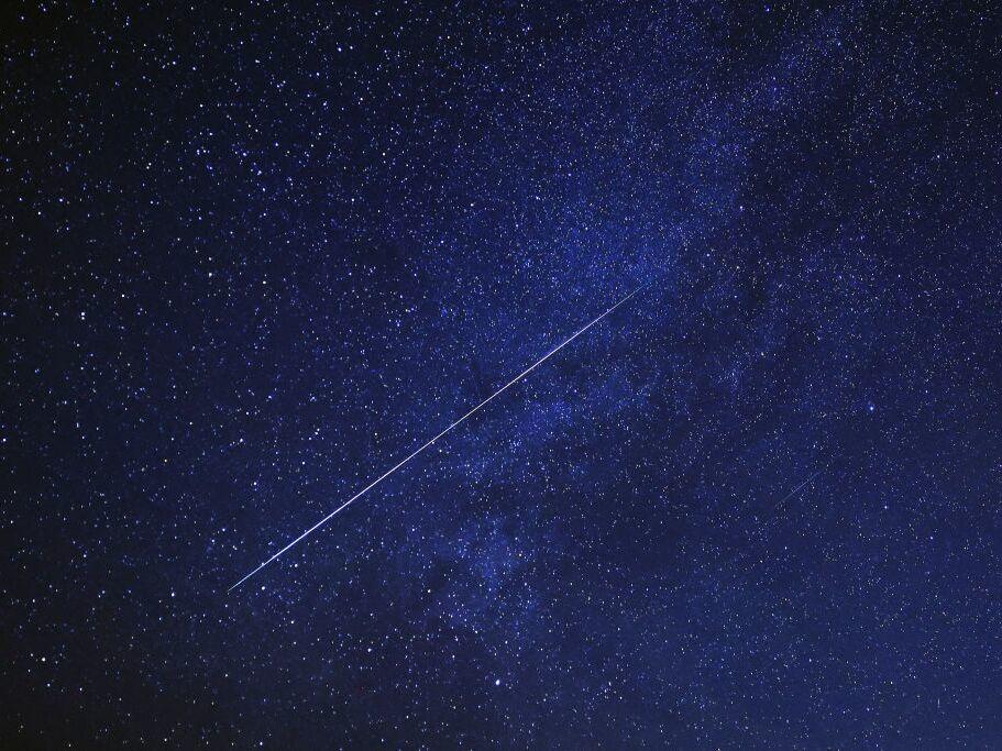 A meteor burns up in the sky over al-Abrak desert north of Kuwait City during the annual Geminid meteor shower early on Dec. 15, 2023.