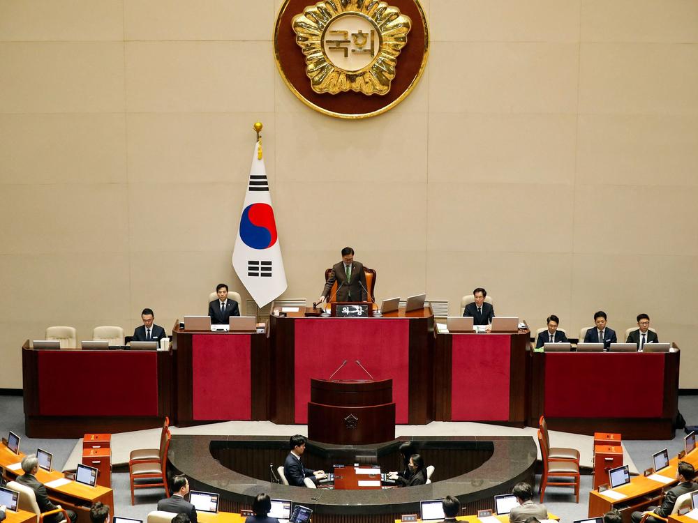 South Korean National Assembly Speaker Woo Won-shik bangs the gavel to initiate the plenary session for the impeachment vote of President Yoon Suk Yeol at the National Assembly in Seoul, on Saturday.