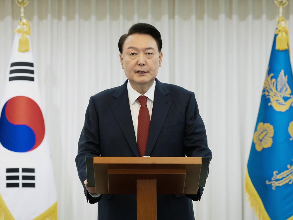 In this handout photo provided by the South Korean Presidential Office, South Korean President Yoon Suk-Yeol speaks to the nation at the Presidential Office on December 14, 2024 in Seoul, South Korea.