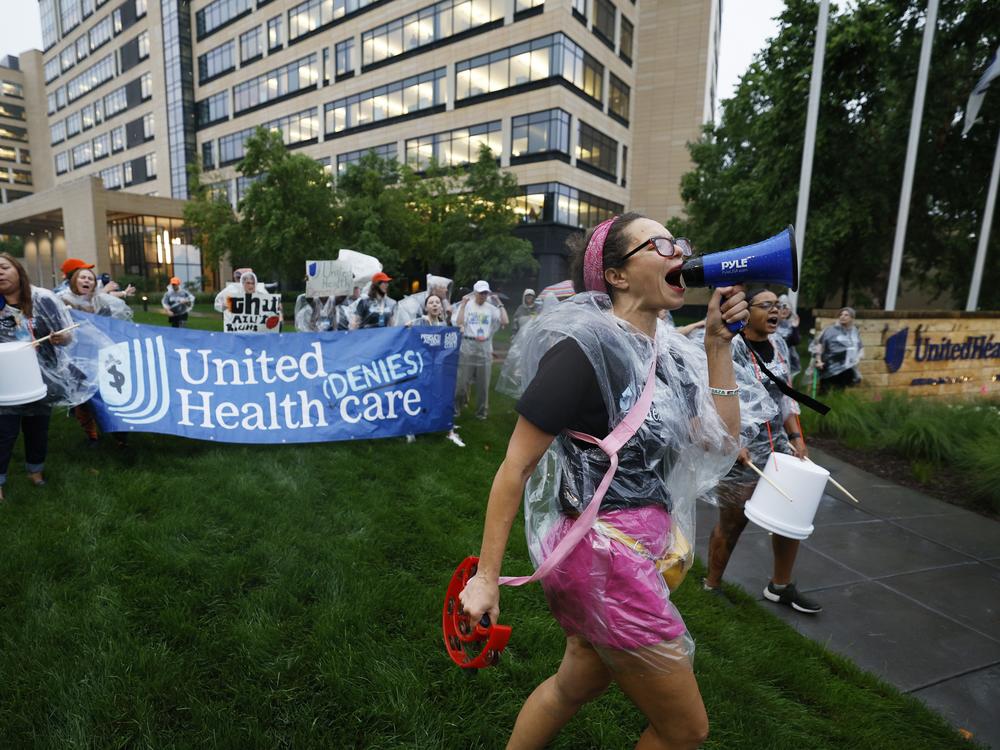 Health care advocates are shown protesting care denials at UnitedHealthcare's offices on July 15, 2024 in Minnetonka, Minnesota.