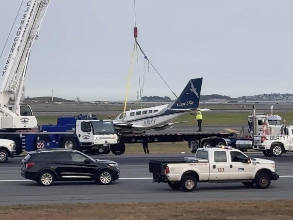 In this image made from video, officials remove a small plane that landed at Logan International Airport after having only one of its landing wheels deploy, Tuesday, Sept. 17, 2024, in Boston.