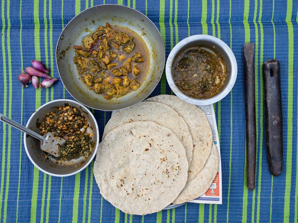 Here's a sampling of dishes from the Dalit culinary tradition, whose recipes are all included in <em>Dalit Kitchens of Marathwada.  </em>Clockwise from the big bowl in the upper left): Chicken curry with yesur, a powdered spice mix that contains red chilies, coconut and eight other spices; shepu and chuka, a mix of two green vegetables:⁠  ⁠jowar bhakri, a flatbread made of millet; a bowl containing two separate mixed veggie dishes — methi with moong dal (fenugreek and lentils) on the top and paat with toor…