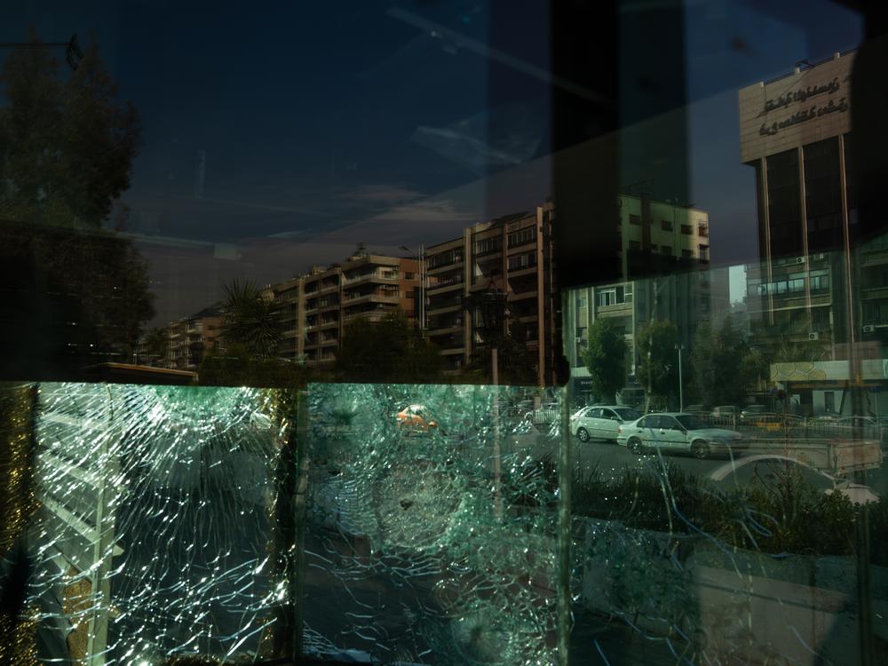 Shattered windows at the Iranian embassy in Damascus. All over the city are signs of the changes happening in Syria.