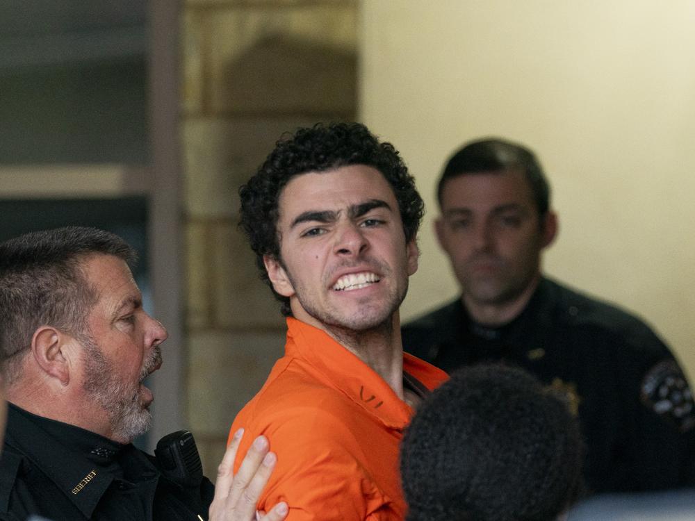 Suspect Luigi Mangione is taken into the Blair County Courthouse on Dec. 10 in Hollidaysburg, Pa.