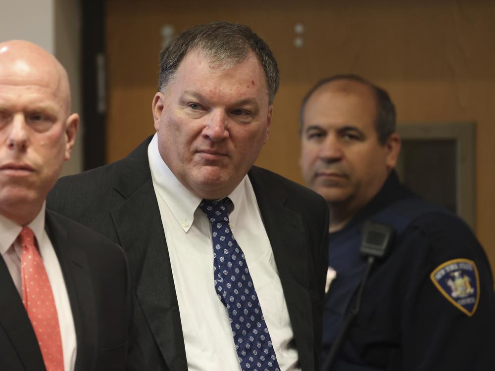 Rex Heuermann (center) charged in the Gilgo Beach serial killings on Long Island, appears for a hearing on July 30 at Suffolk County Court in Riverhead, N.Y.