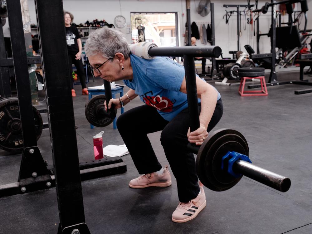 Emily Socolinsky's mom, Joanne Giza (seen here), also works out at this gym. Giza, 75, has been focusing on squats and presses to help with her posture.