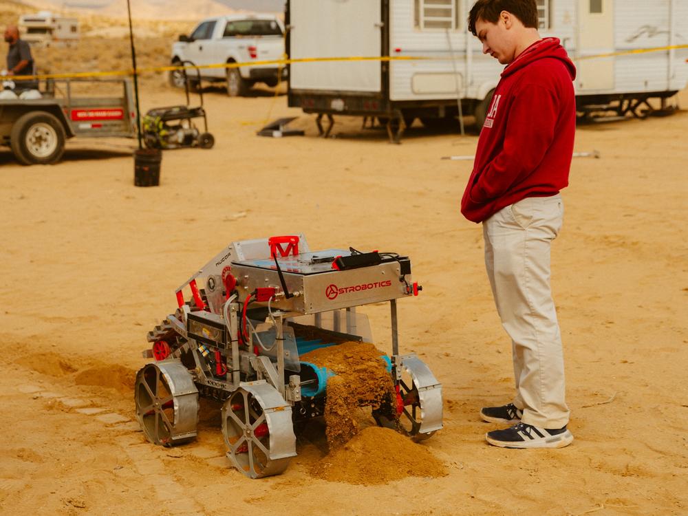 The University of Alabama team showcase their excavator robot.