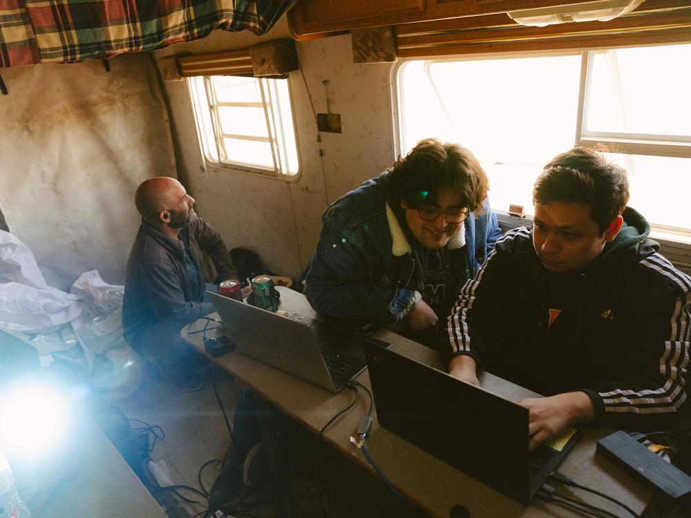 Students from Cal Poly Pomona strategize while piloting the Helelani rover.