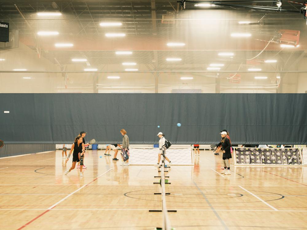 Pickleball players warm up before their competition at the Florida Senior Games.