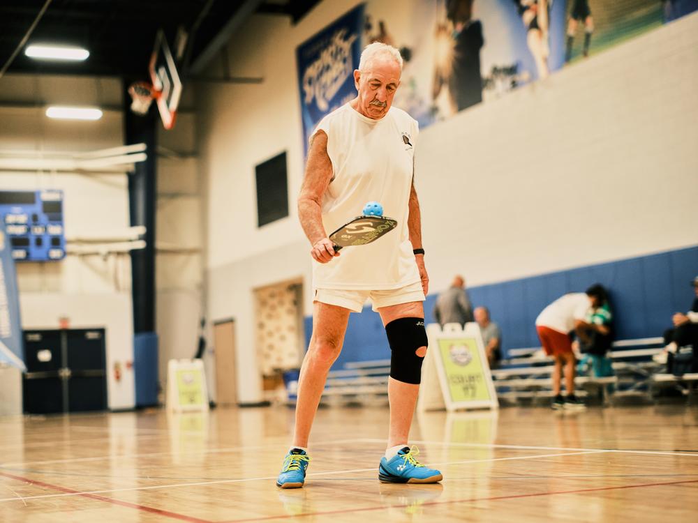 Gene Berg, 72, competes in his singles match at the Florida Senior Games.
