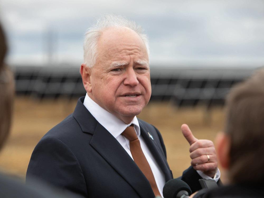 Minn Gov. Tim Walz answers reporters' questions Tuesday, Nov. 19, 2024 after a ceremony marking the completion of Xcel Energy's Sherco Solar 1 project northwest of Becker, Minn. The project is expected to provide power for as many as 150,000 homes.