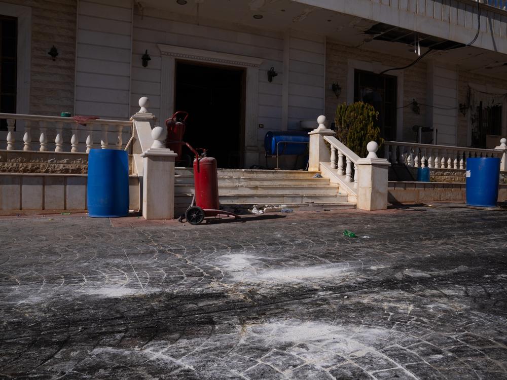 White powder dusts the driveway at the entrance to the building where Captagon was being made.
