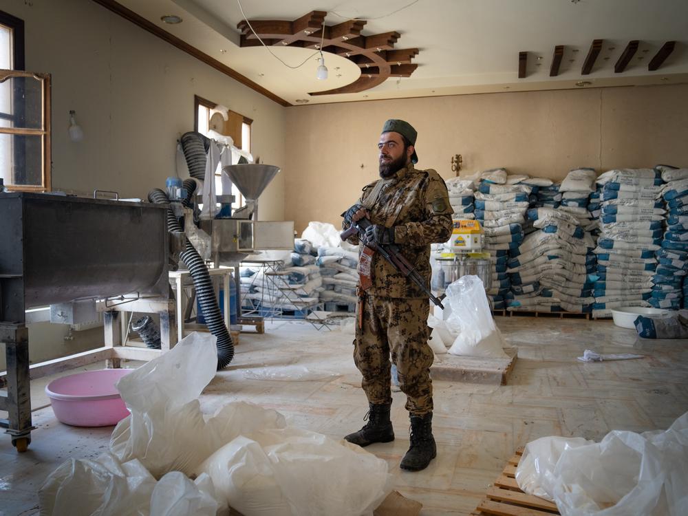 Abu Bakr al-Tartousi, part of the HTS military that now is guarding the building where Captagon was made.