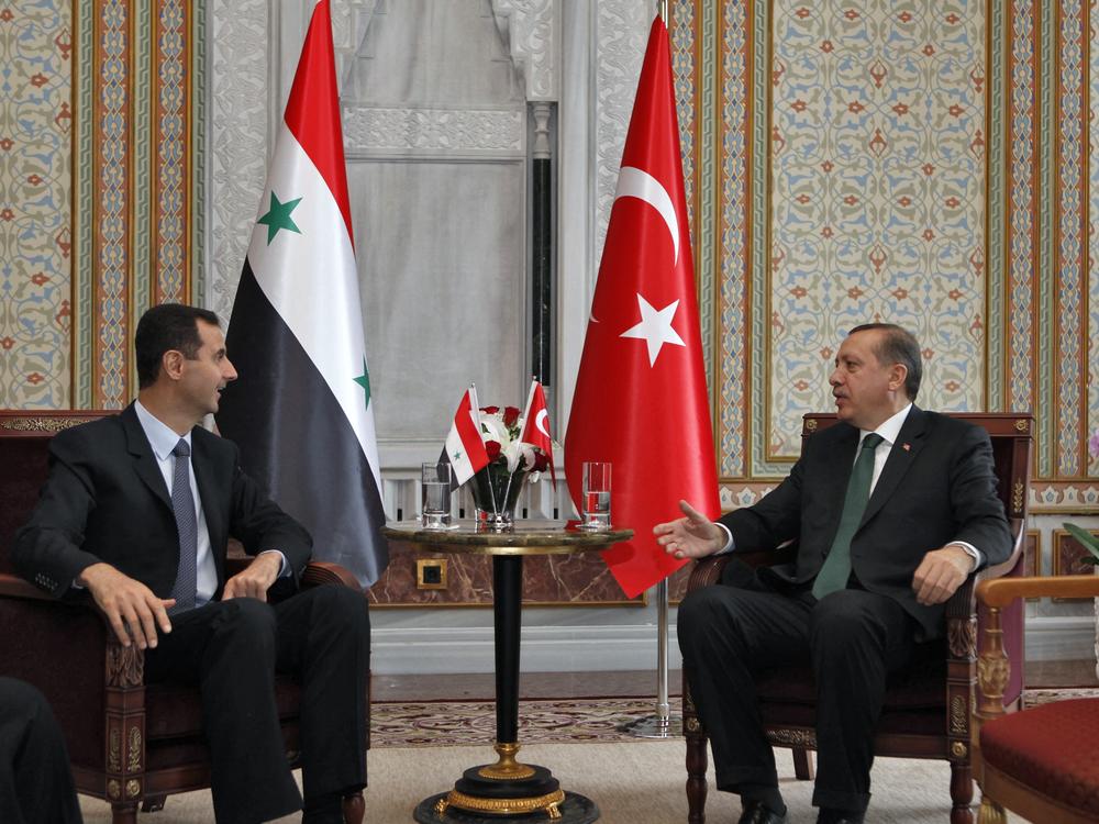 Then-Syrian President Bashar al-Assad (left) talks with Recep Tayyip Erdogan, Turkey's prime minister at the time, during a meeting in Istanbul on June 7, 2010.