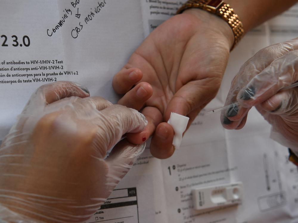 A woman in Manila gets blood drawn for an HIV test. HIV infections are soaring in the Philippines. Health specialists blame a lack of sex education and the stigma associated with visiting an HIV clinic in this deeply religious country.