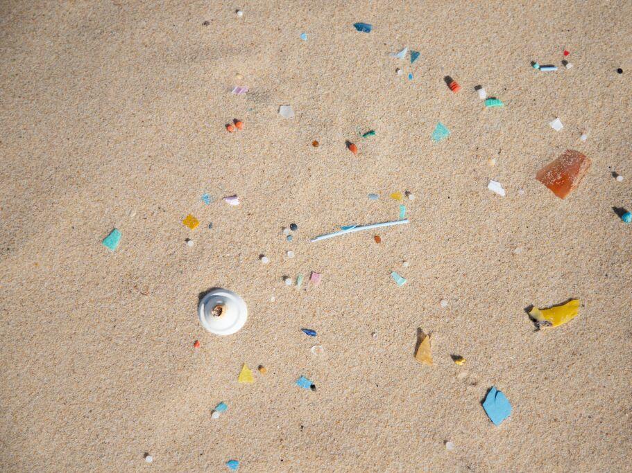Plastics and microplastics of different shapes and colors are laid on the fine sand of the Grand Crohot beach in Lege-Cap-Ferret in New Aquitaine in France in 2019.