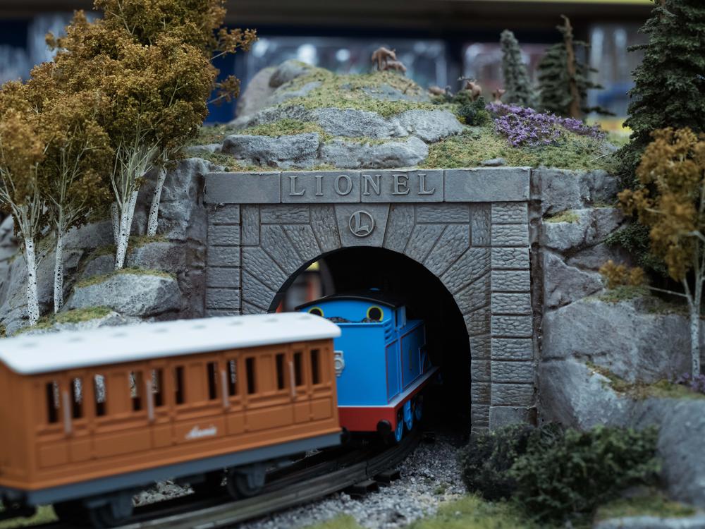 A Lionel Thomas the Tank Engine train set enters a tunnel at TrainLand. It's one of the many brands Lionel licenses.