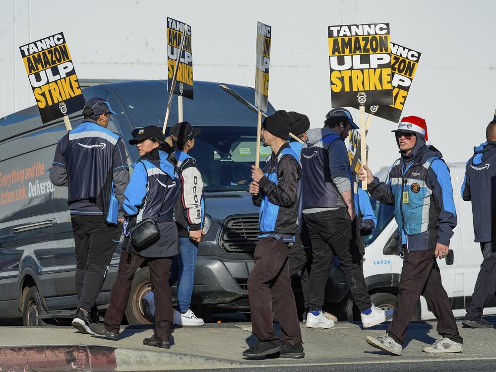 Amazon workers strike outside the gates of an Amazon fulfillment center in City of Industry, Calif., on Thursday.