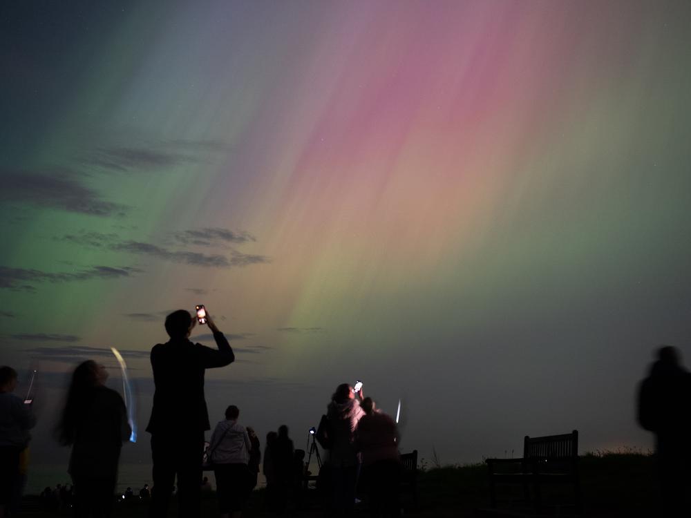 People visit St Mary's lighthouse in Whitley Bay, England, to see the northern lights