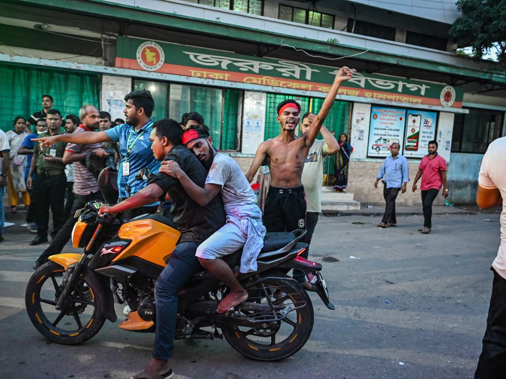 An injured protester is brought for treatment at Dhaka Medical College Hospital during a clash with police and protesters on Aug. 4.