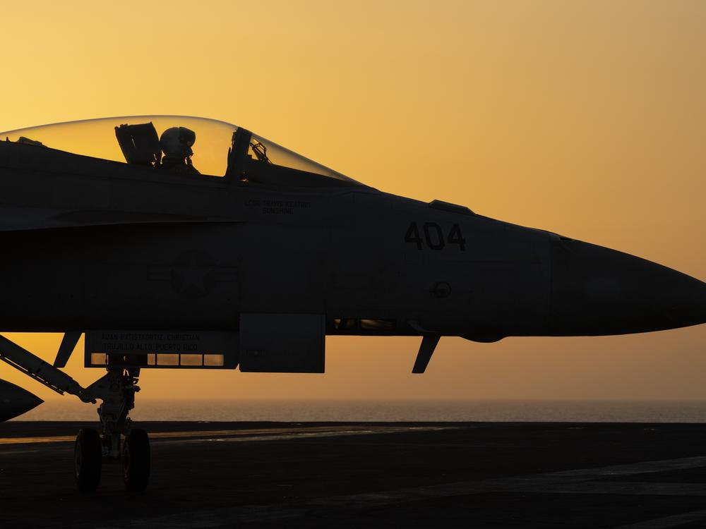 A fighter jet maneuvers on the deck of the USS Dwight D. Eisenhower in the Red Sea, June 11, 2024.