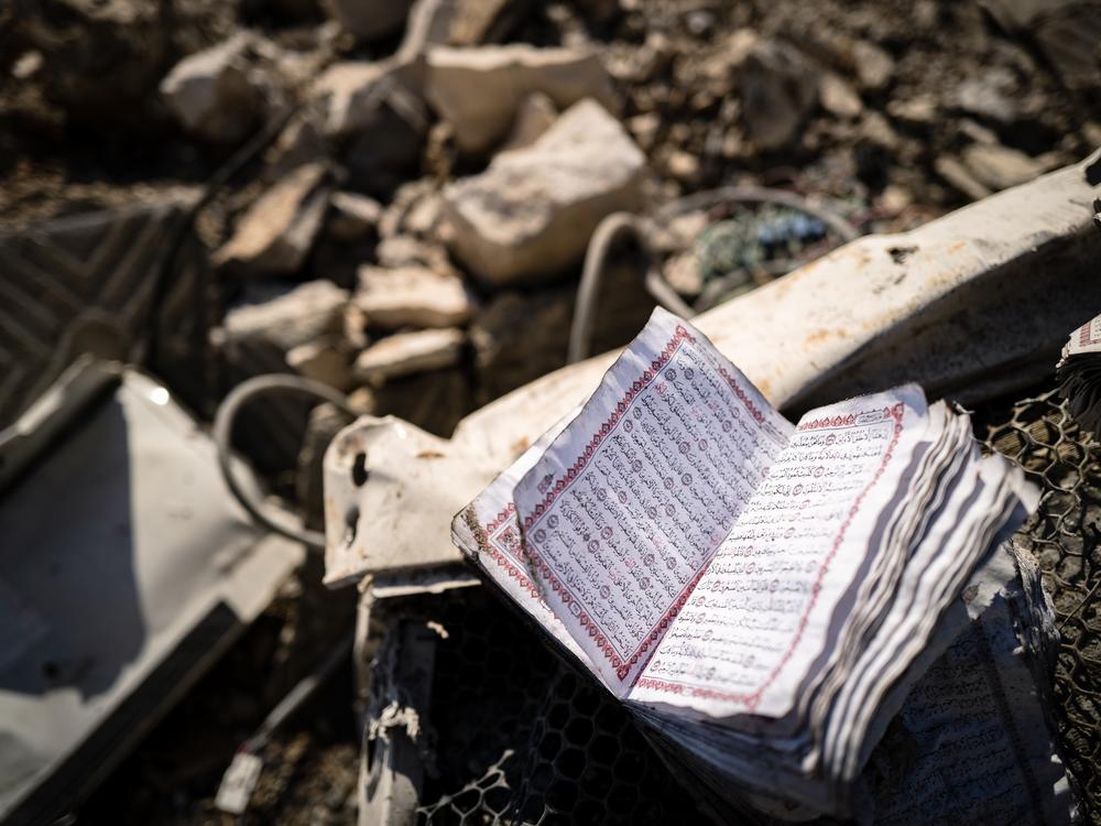A Quran lies in the rubble of a 250-year-old mosque in southern Lebanon, following an Israeli strike.