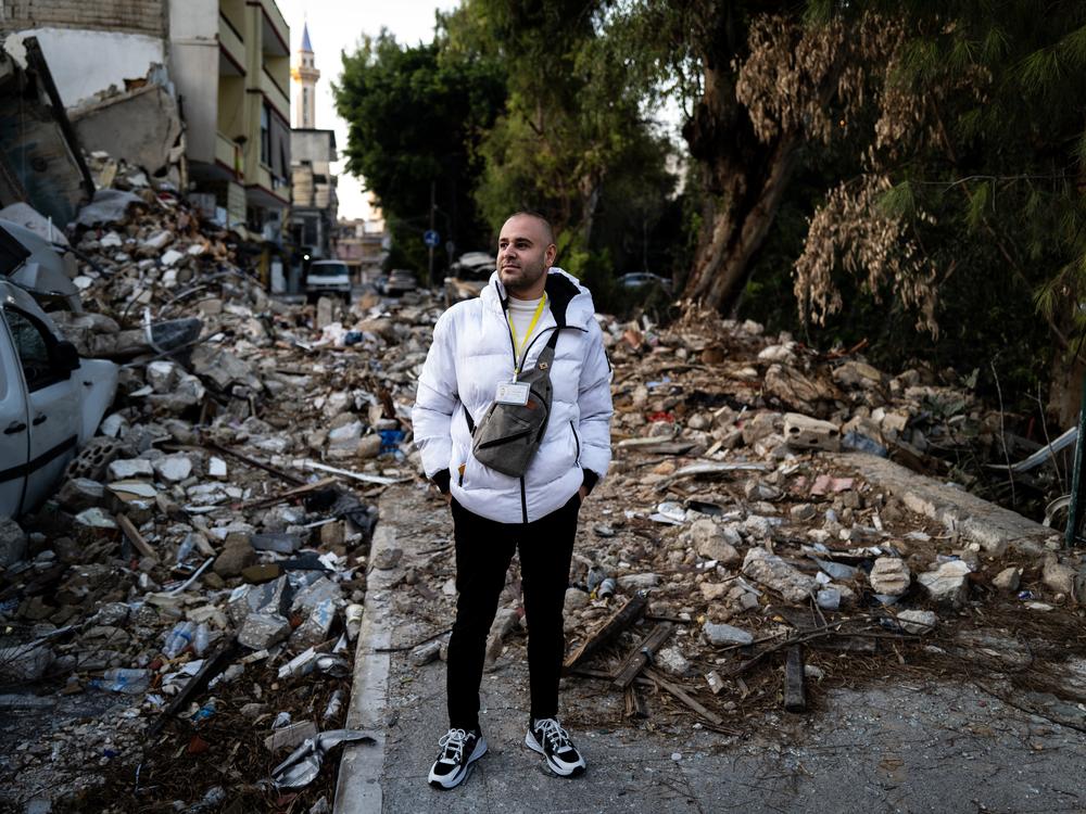 Archaeologist Mahmoud Ghazal stands amid the wreckage of an Israeli strike in Tyre, southern Lebanon.