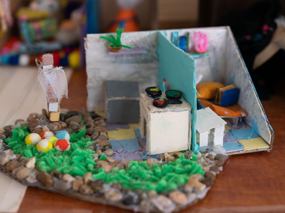 A diorama of a home seen in a classroom in the temporary elementary school for the displaced residents of Be'eri. As part of an art therapy program, children make dioramas of the homes they left behind, some of which were destroyed on Oct. 7, 2023.