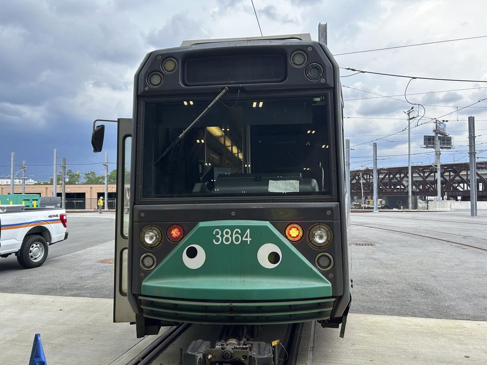 An MBTA subway car dons googly eyes under its front windshield in Boston.