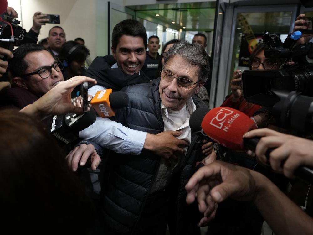 Media swarm Fabio Ochoa, center, a former member of Cartel of Medellin, upon his arrival at El Dorado airport, after being deported from the United States, in Bogota, Colombia, on Monday.