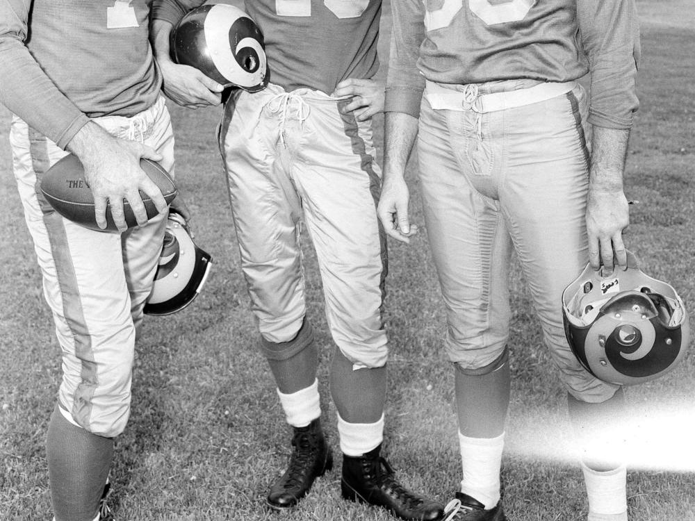 The Los Angeles Rams high-powered passing combination, probably football's best, gets together at Redlands, Calif., as the NFL titleholders began drills July 23, 1952. From left: quarterback Bob Waterfield and ends Elroy Hirsch and Tom Fears.