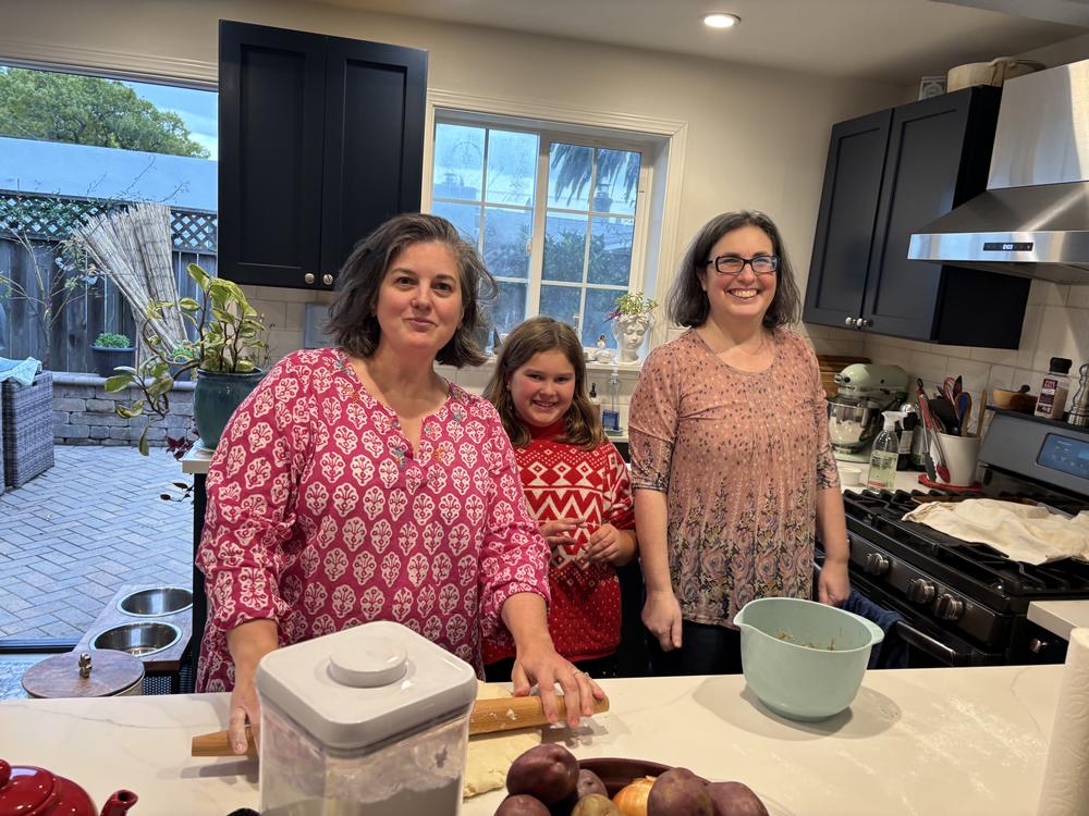 The Weiss-Pires family — Lynda, Lillian and Bessie — enjoy baking Christmas and Hanukkah treats during the holiday season in their kitchen in Oakland, Calif.