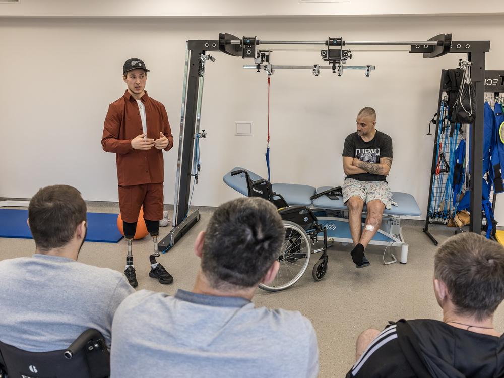 Oleksandr Budko, whose military call sign is Teren, talks to injured soldiers at the Recovery rehabilitation center in Kyiv, Ukraine, on Oct. 18.