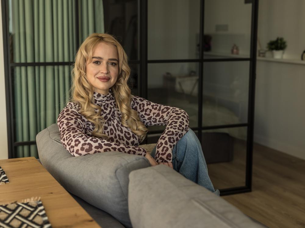 Inna Bielien, 29, a German language translator, poses for a portrait at home in Kyiv, Ukraine, on Dec. 13. She is one of the female contestant of the Ukrainian version of the TV show <em>The Bachelor.</em>