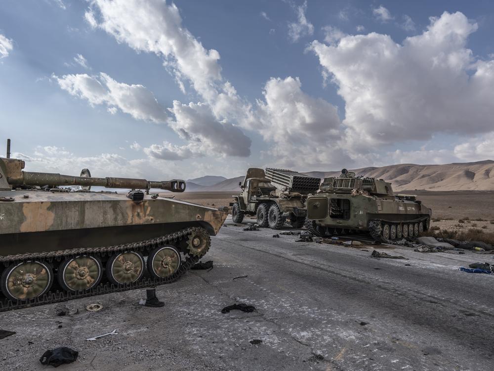 Armored vehicles abandoned near the M2 highway heading from Damascus to the Iraqi border in Syria, Dec. 13.