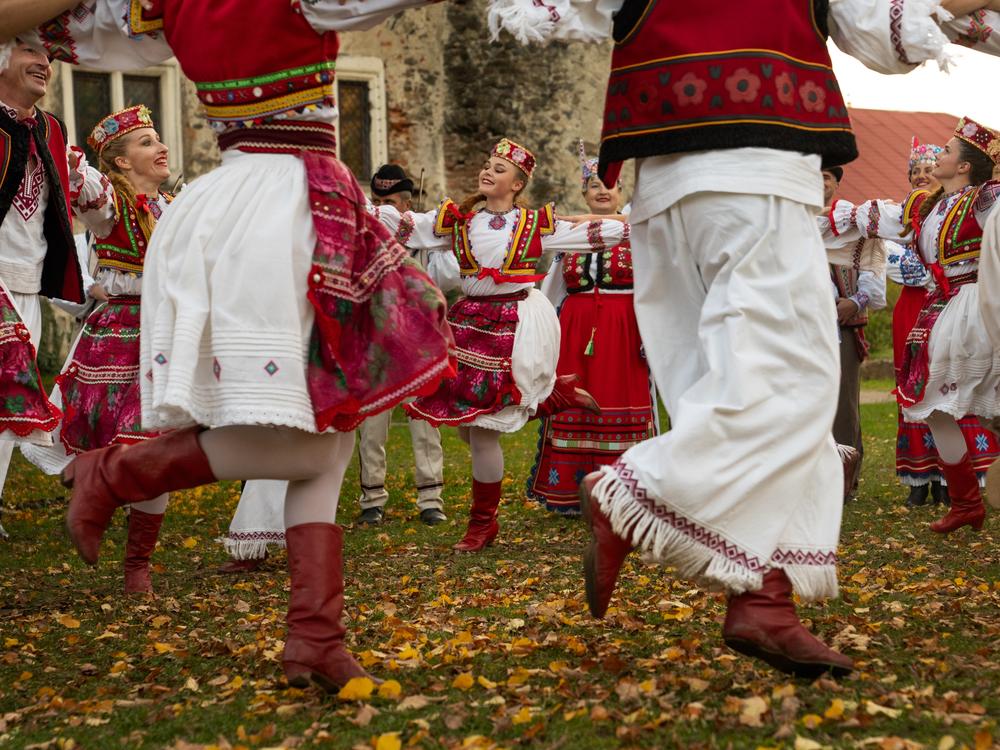 The Transcarpathian Folk Choir performs a dance while filming a music video.