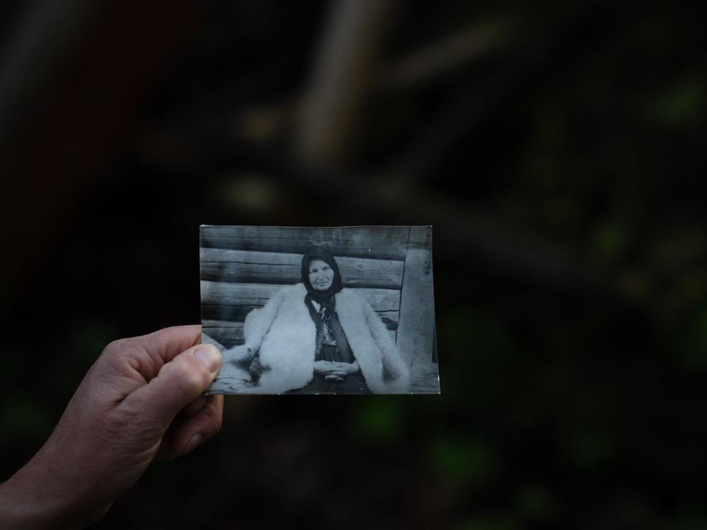 Olha Mys shows a photo of her grandmother wearing a hunia. The tradition of crafting the coats has been in the family for generations.