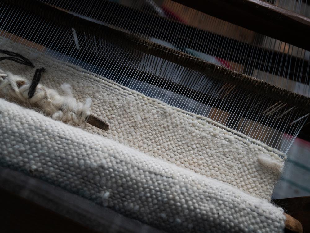 Wool from local sheep is used in making a hunia.